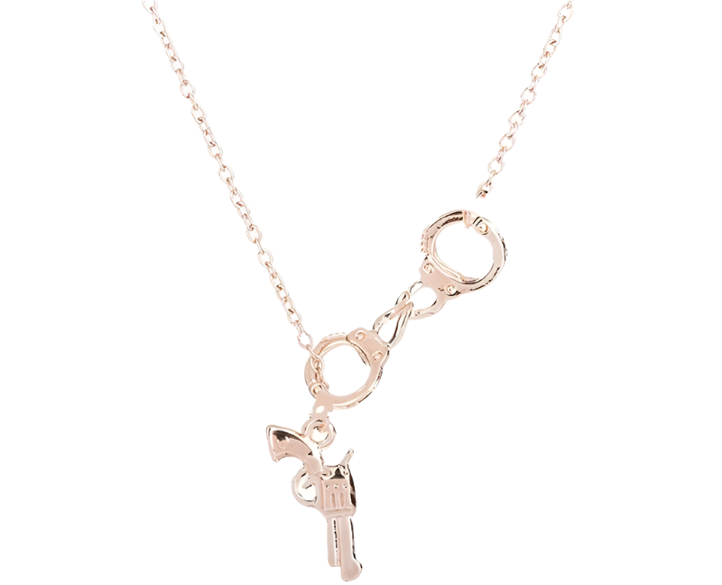 Rose gold necklace with handcuff and key pendant on a white background