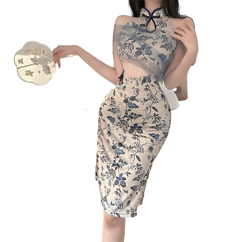 Person wearing a floral dress in a bedroom setting