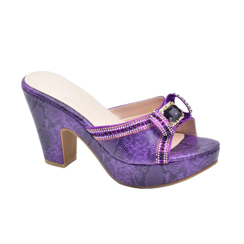 Purple high-heeled shoe with embellishments on a white background