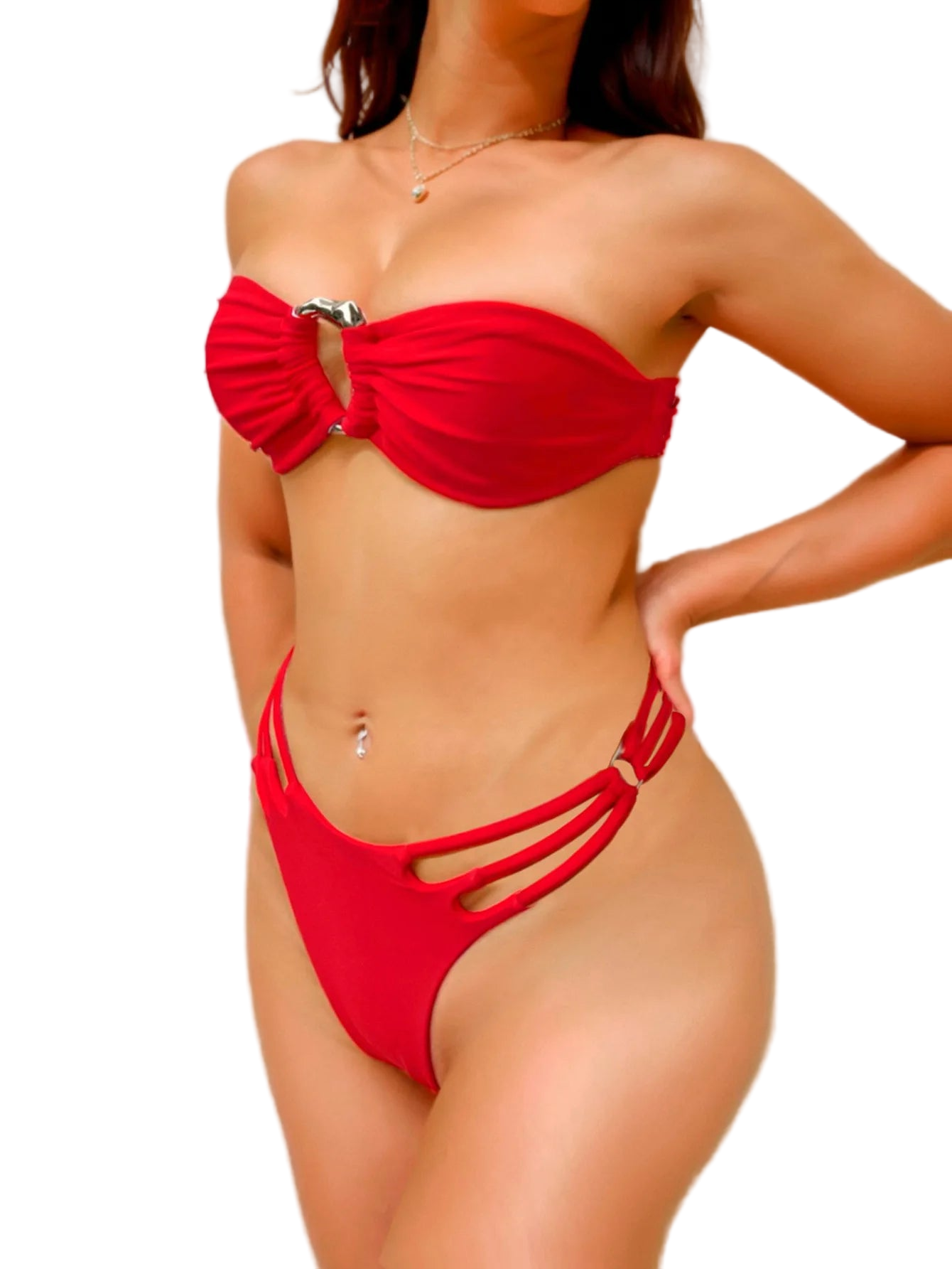 Red bikini worn by a person on a plain background