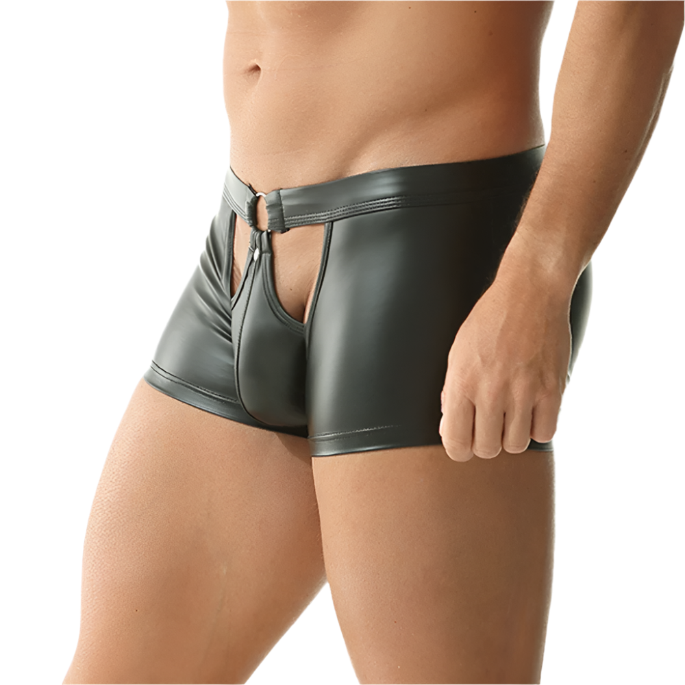 Person wearing black leather shorts on a white background