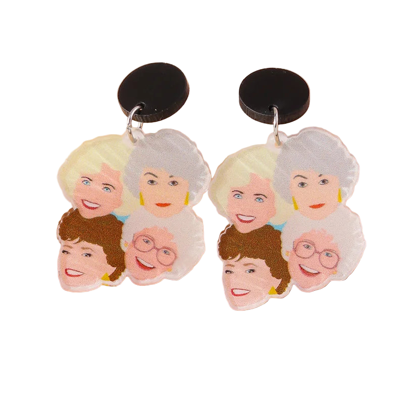 Earrings with cartoon-like faces of elderly women on a beige background