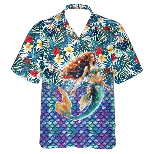 A short-sleeve button-up Hawaiian shirt featuring a vibrant tropical print with palm leaves, flowers, and a mermaid illustration on the front, displayed against a plain white background.