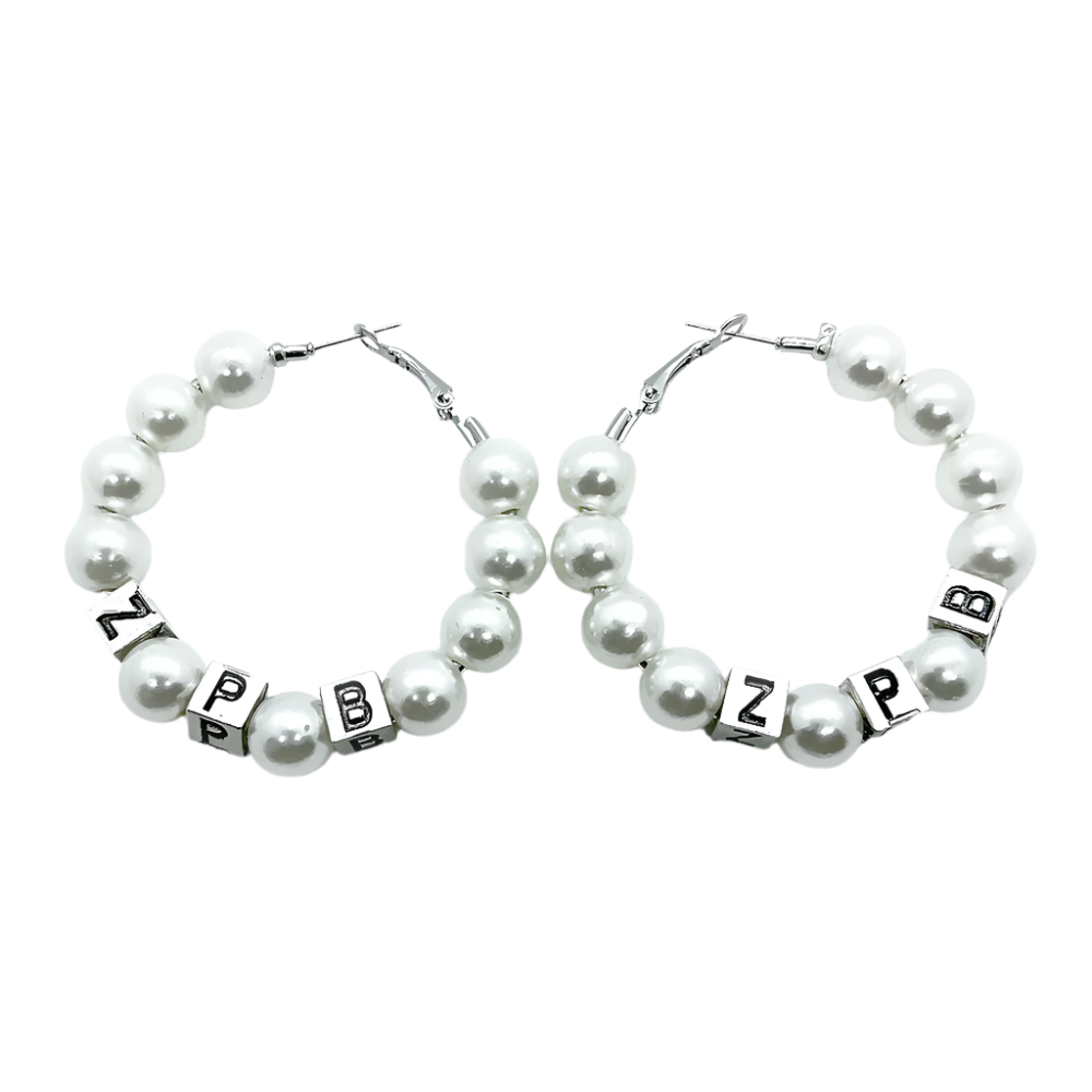 Pearl hoop earrings with letter beads on a white background