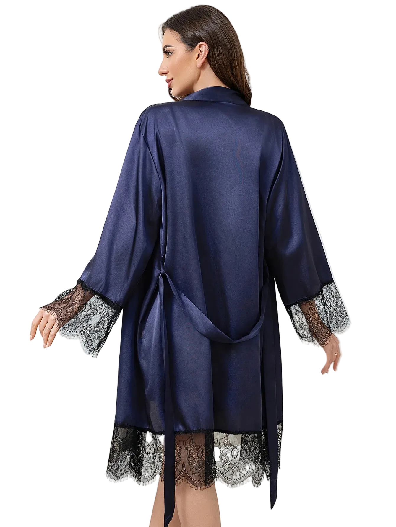 Woman wearing a navy satin robe with lace cuffs and hem on a white background