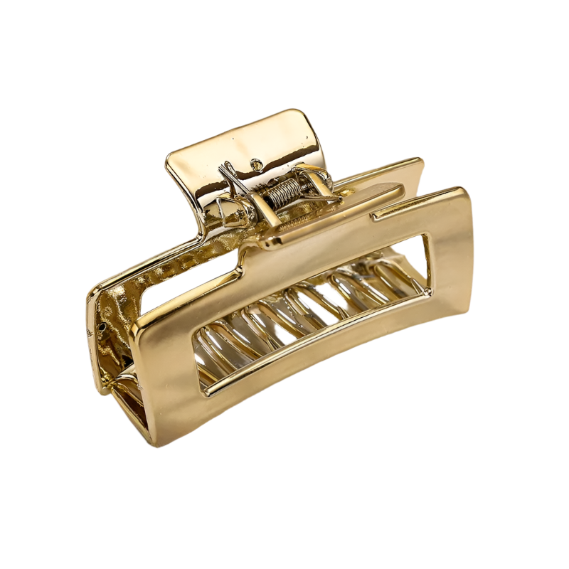 Gold hair clip on a white background