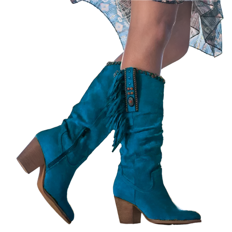Teal knee-high boots with fringe details on a blurred outdoor background