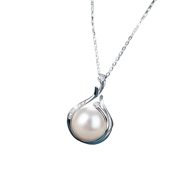 Pearl necklace with silver chain on a dark blue fabric background