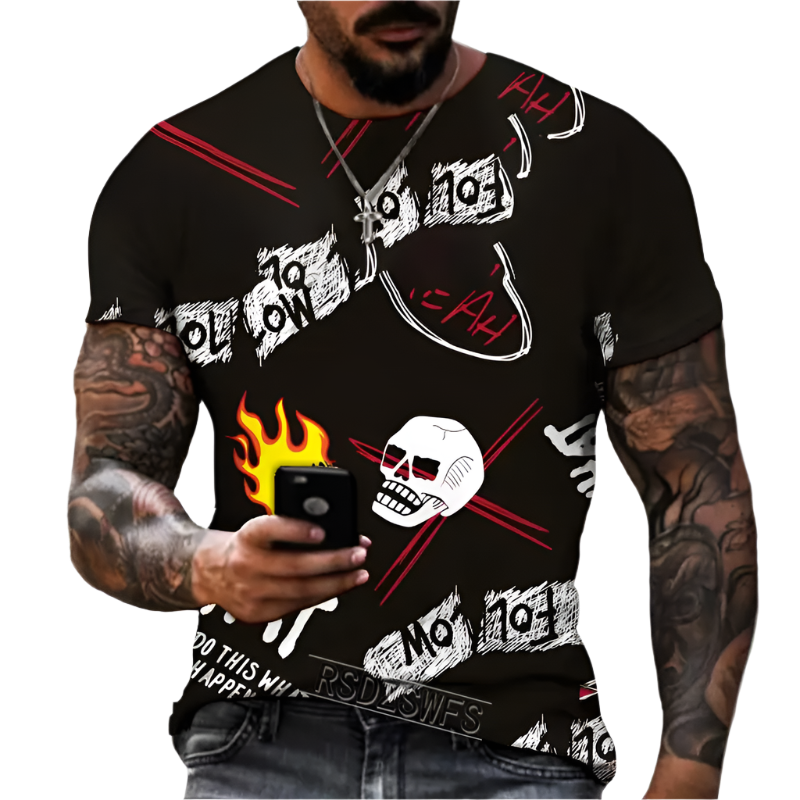 Man wearing a black t-shirt with graphic designs and text, holding a phone.