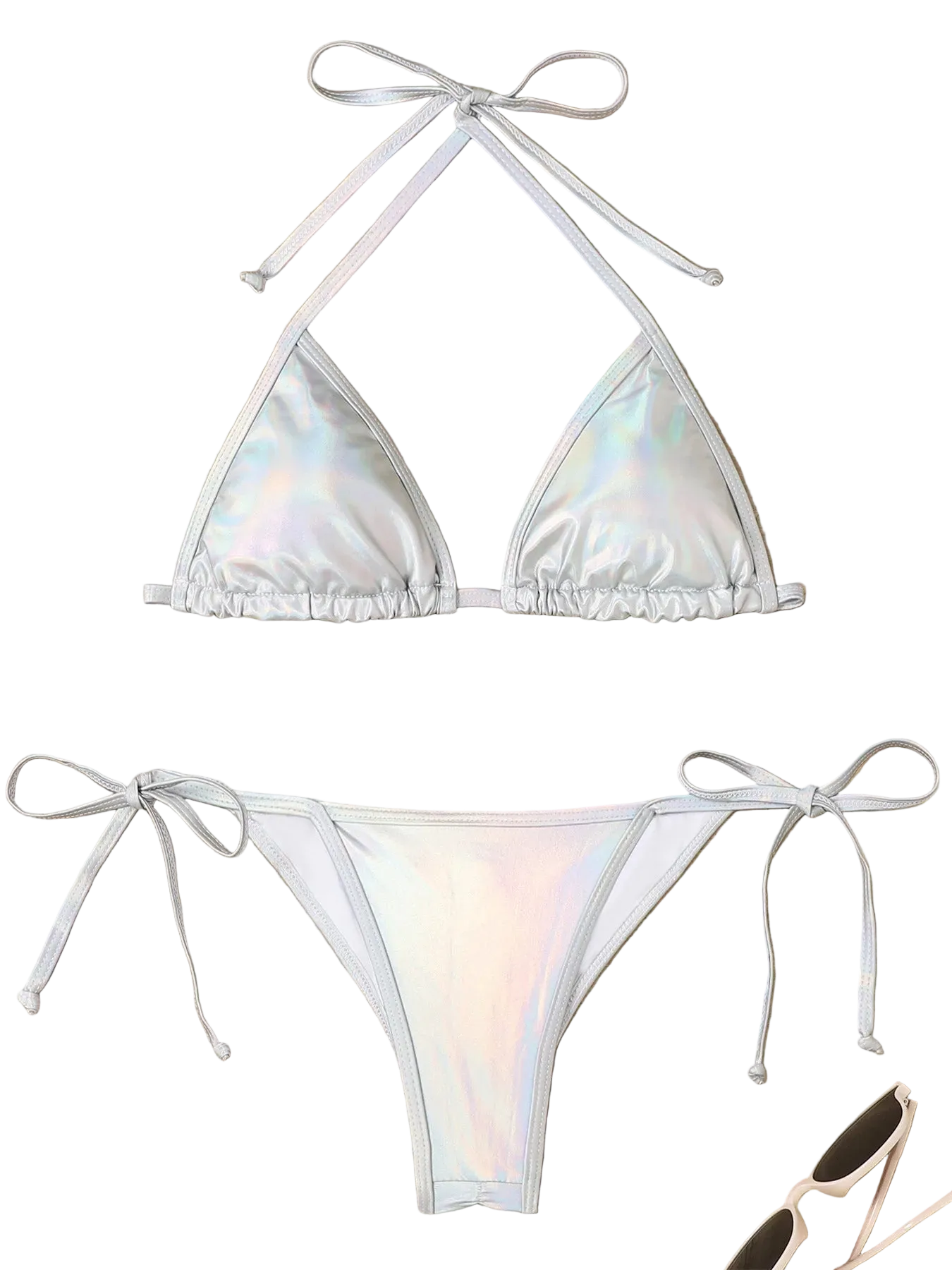 Holographic bikini set on a wooden surface with accessories.