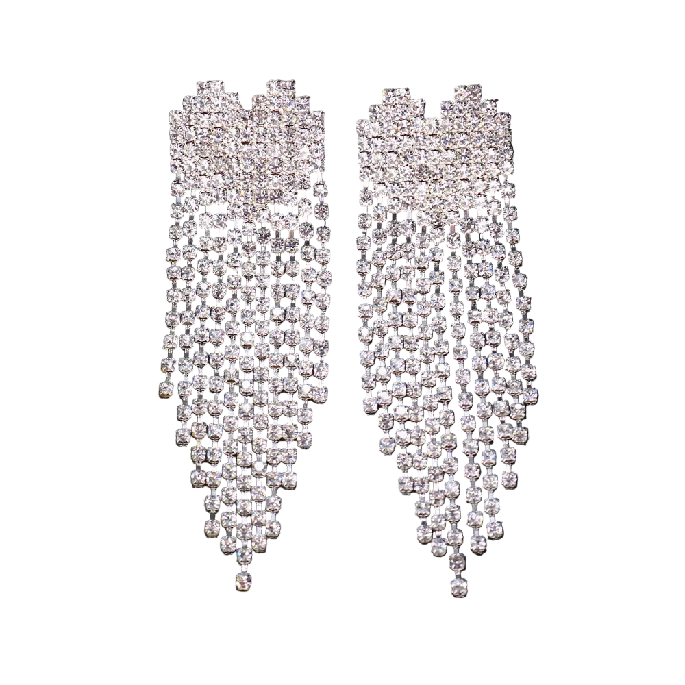 Pair of silver teardrop-shaped earrings with clear stones on a black background