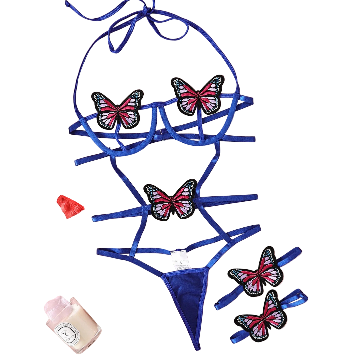 Blue lingerie set with butterfly designs on a pink fabric background