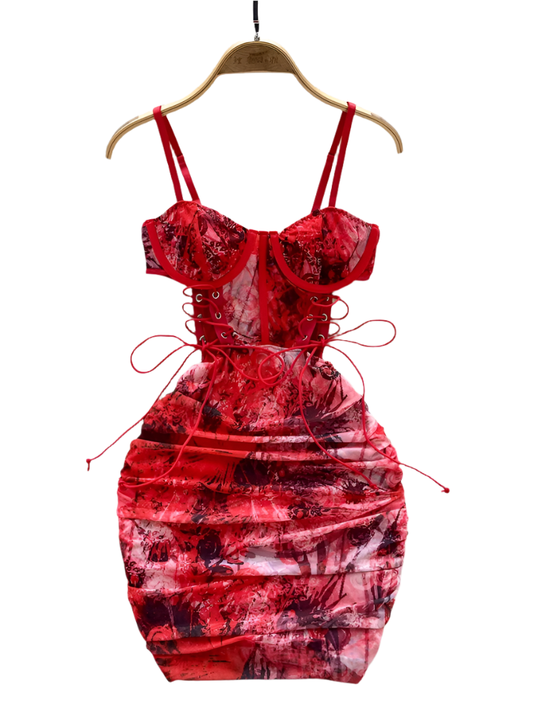 Red floral dress on a hanger with a white fur rug and flowers in the background