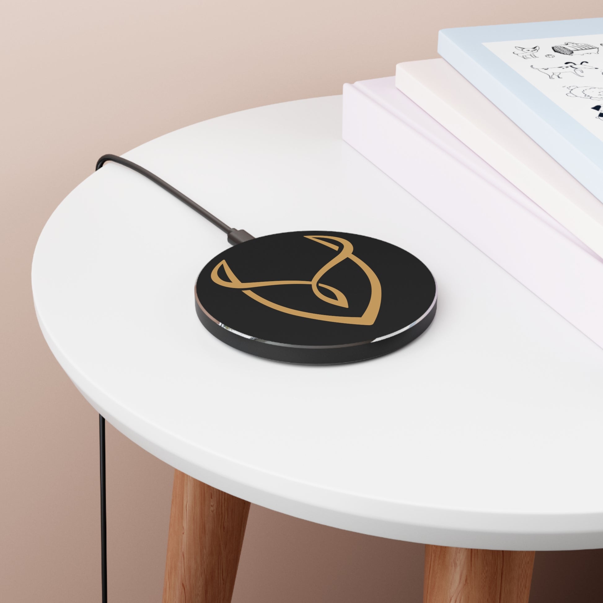 Wireless charging pad with a logo on a white table