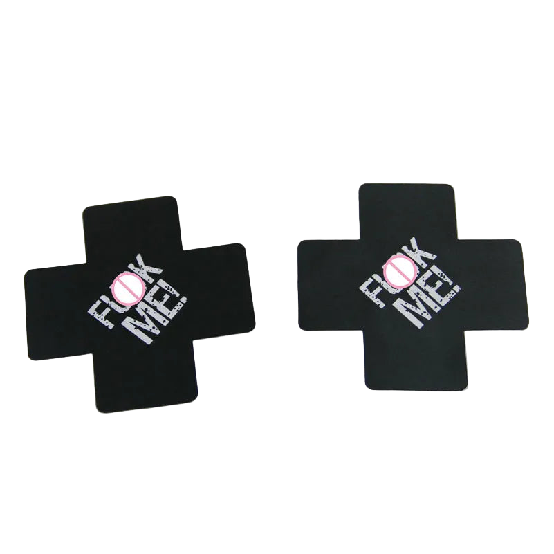 Black cross-shaped stickers with 'F**K ME!' text on a white background