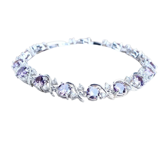 Silver bracelet with purple stones on a branded stand
