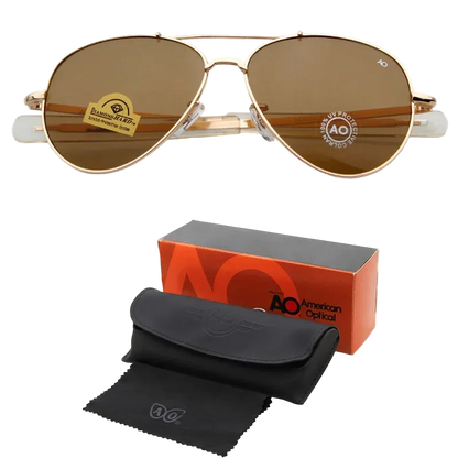 AO aviator sunglasses with brown lenses and a gold-tone metal frame, shown above their orange and black retail box, black hard case, and black microfiber cleaning cloth on a white background.