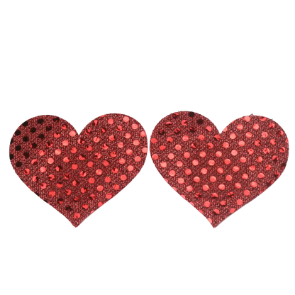 Red heart-shaped pasties with polka dot pattern on a white background