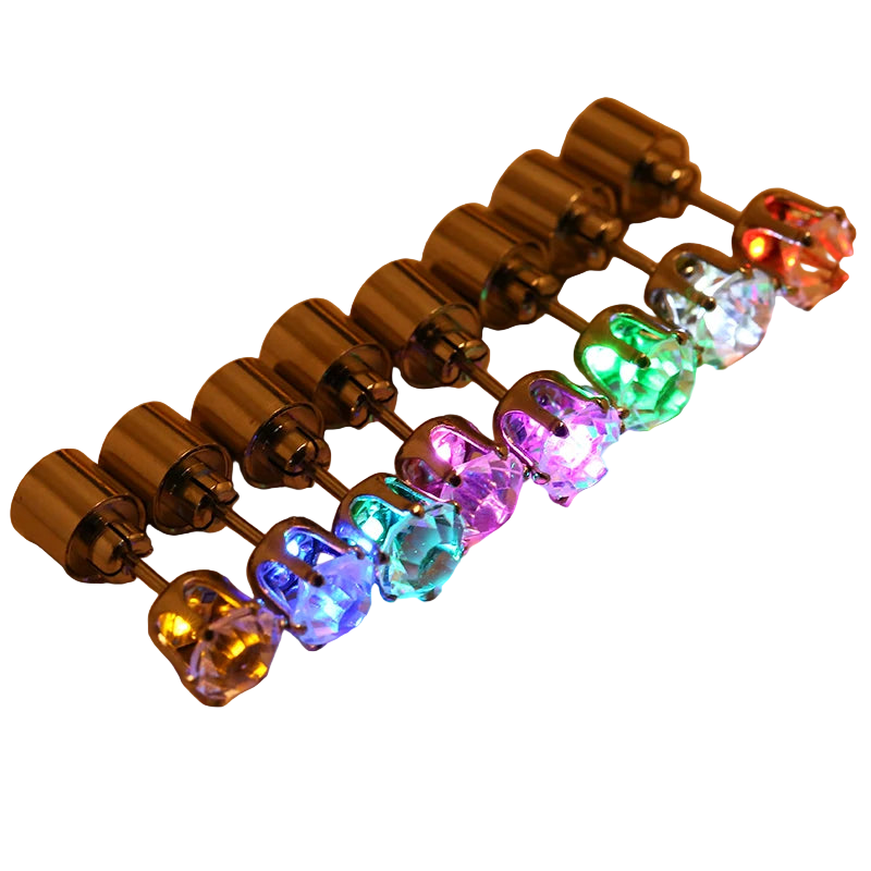 Colorful LED earrings on a beige background