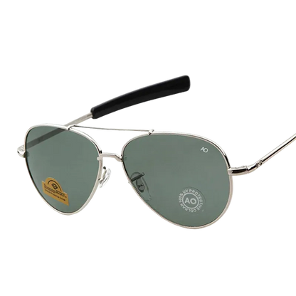 Silver metal aviator sunglasses with green-tinted lenses and black temple arms, shown on a white background 