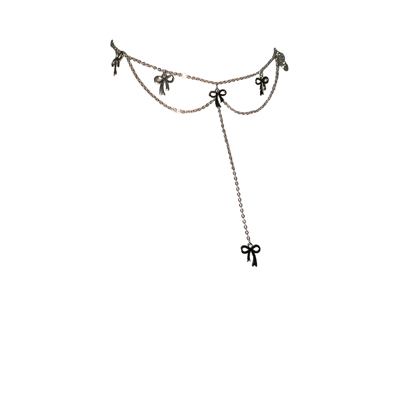 A close-up of a model's neck and upper chest wearing a delicate silver-toned double-layered choker necklace with small bow charms and a long dangle chain ending in a bow.
