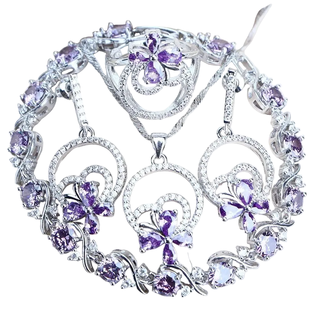 Silver necklace with purple gemstone pendants on a white background