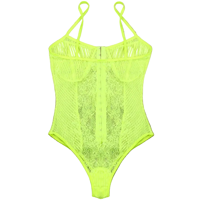 A neon yellow-green lace and mesh bodysuit with thin shoulder straps, laid flat on a dark brown wooden plank background.