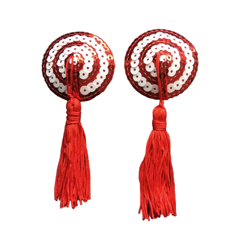 Pair of red and white sequin earrings with tassels on a dark background