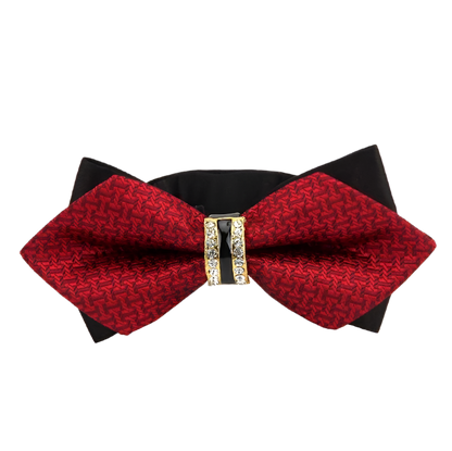Red bow tie with black base and decorative clasp on a white background