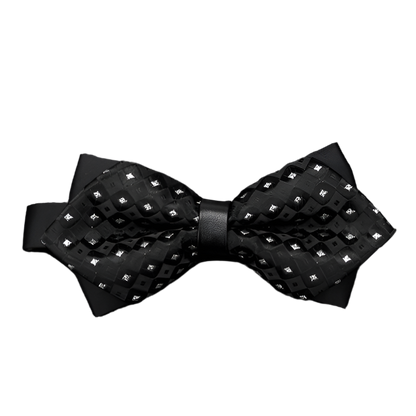 Black bow tie with diamond pattern on a textured gray background
