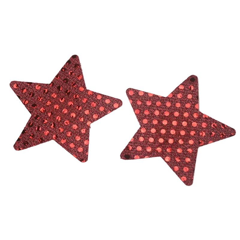 Two red star-shaped stud earrings with a black sequin background and pink polka dots, shown on a white