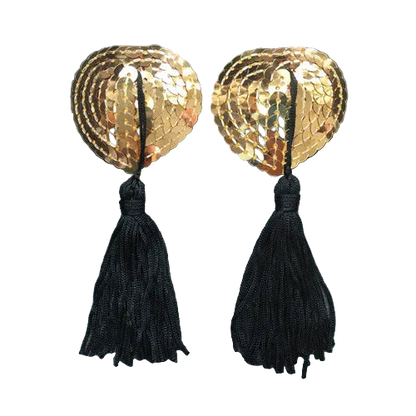 Pair of gold leaf-shaped earrings with black tassels on a gray background