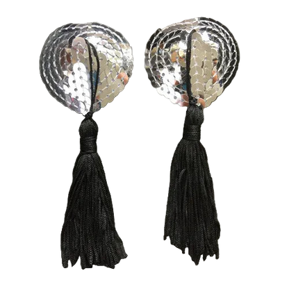 Pair of earrings with silver sequin disc and black tassel on a dark background