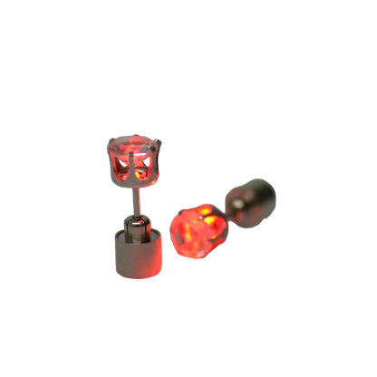 Red LED earrings on a gray background
