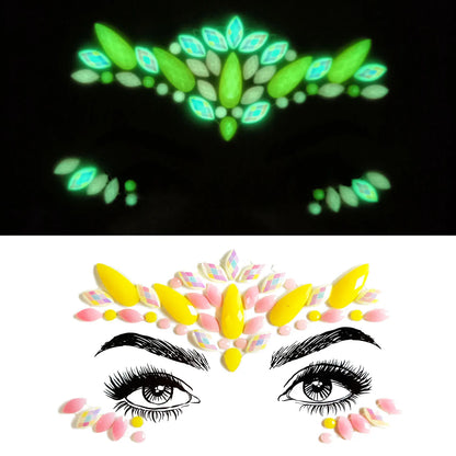 Glowing face paint designs on a black background with a white background showing a stylized eye design.