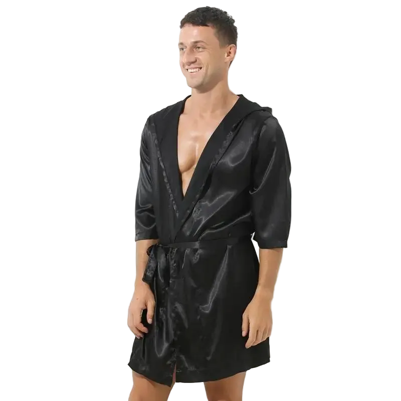 Man wearing a black satin robe on a white background