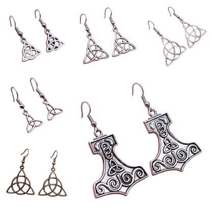 Six-panel collage showing silver-toned Celtic knot triquetra dangle earrings held in a person's hand, with two additional views showing one earring in bronze-toned metal. The earrings feature a Celtic knot triquetra design and a hammer-shaped pendant with Celtic knot details.