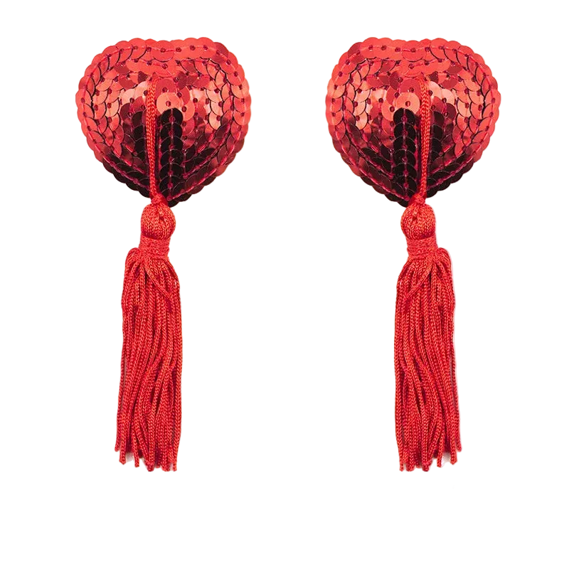 Red heart-shaped sequin pasties with tassels on a white background