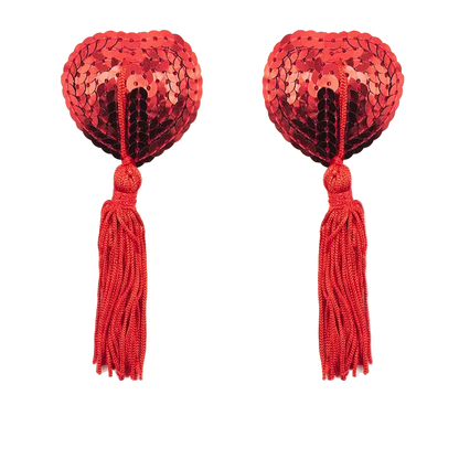 Red heart-shaped sequin pasties with tassels on a white background