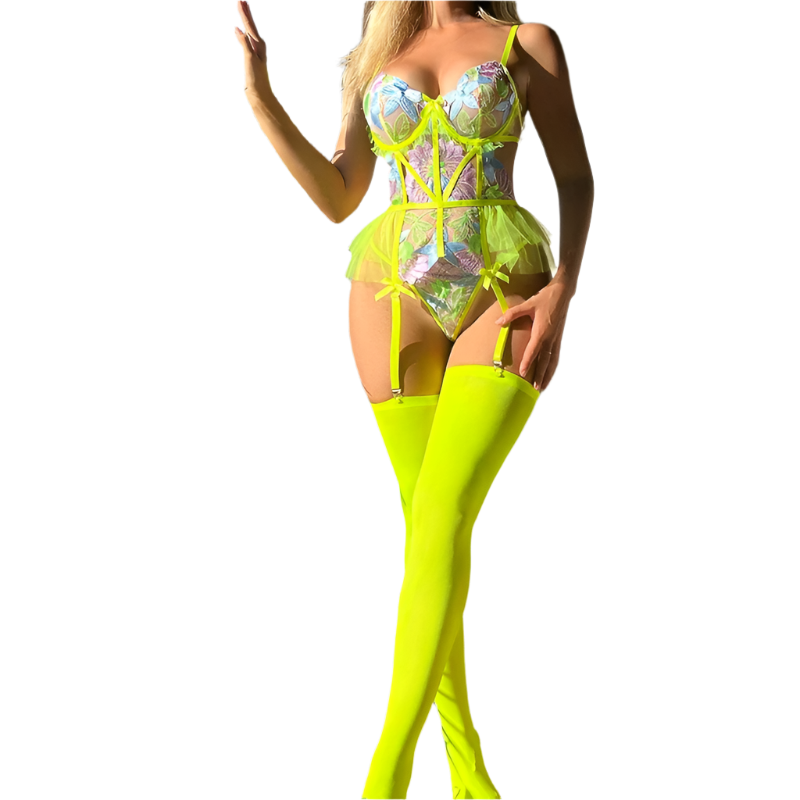 Person wearing a colorful outfit with neon green thigh-high boots in an outdoor setting.