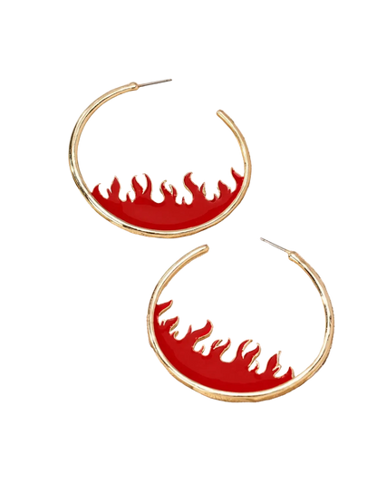 Gold hoop earrings with a red enamel background and flame-shaped cutouts, displayed on a beige jewelry tray.