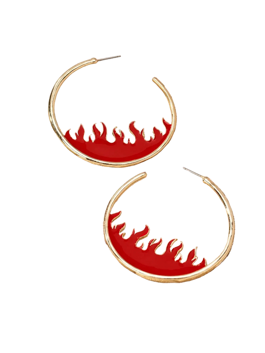 Gold hoop earrings with a red enamel background and flame-shaped cutouts, displayed on a beige jewelry tray.