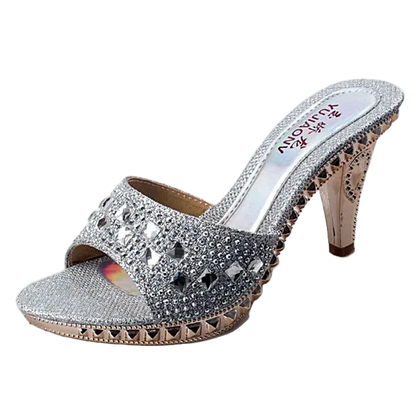 Silver high-heeled sandal with rhinestone embellishments on a white background