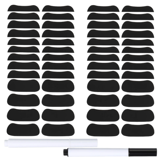 Two sheets of black curved eyelash adhesive patches shown on a white background, with two white-and-black markers placed below the sheets.