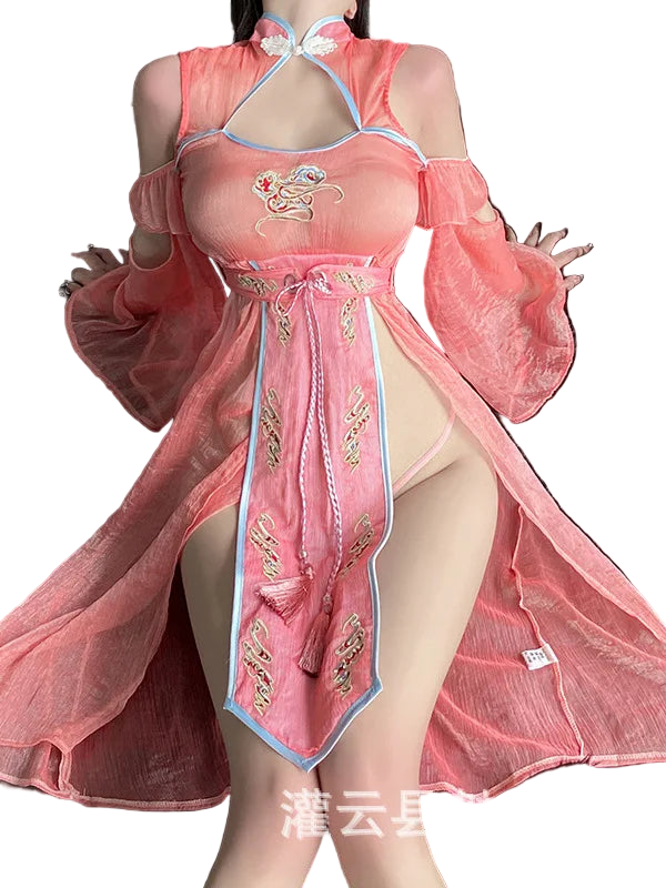 Person wearing a pink traditional outfit with gold embroidery on a dark background