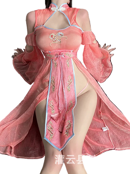 Person wearing a pink traditional outfit with gold embroidery on a dark background