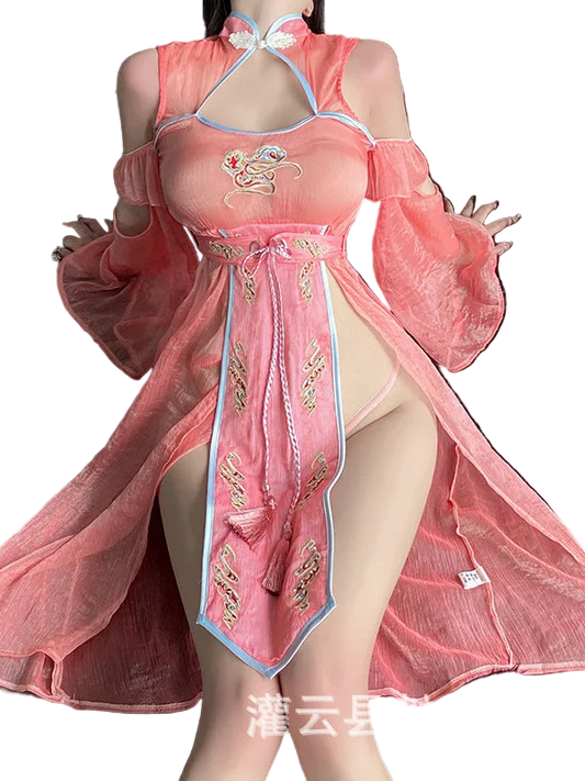 Person wearing a pink traditional outfit with gold embroidery on a dark background