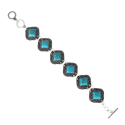 Bracelet with turquoise square stones on a white background