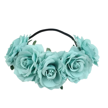 A floral headband featuring large, vibrant roses. The design is bold and romantic, perfect for a bohemian or festival look.