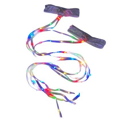Multicolored LED shoelace with two clips on a dark background